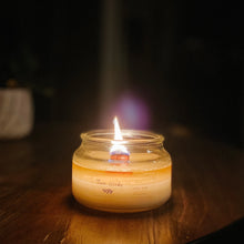 Load image into Gallery viewer, scented soy candle with wood wick burning at night
