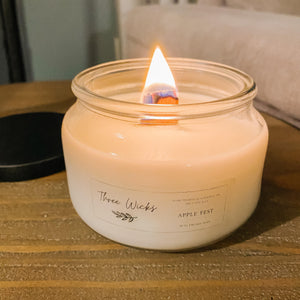 Scented wood wick soy candle in a 10 oz vessel  burning